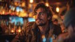 © Margo Alexa - A man talking to friends in a cafe or pub .