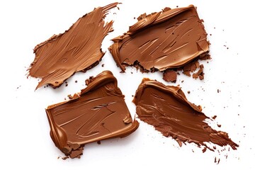 Poster - A close-up shot of four pieces of chocolate on a white surface, perfect for promoting sweet treats or confectionery products