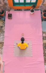 Poster - Woman Practicing Yoga in Office Setting During Work Break, Natural Light and Minimalist Space