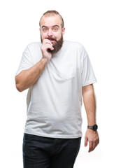 Canvas Print - Young caucasian hipster man wearing casual t-shirt over isolated background looking stressed and nervous with hands on mouth biting nails. Anxiety problem.