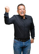 © Krakenimages.com - Handsome middle age arab business man over isolated background angry and mad raising fist frustrated and furious while shouting with anger. Rage and aggressive concept.