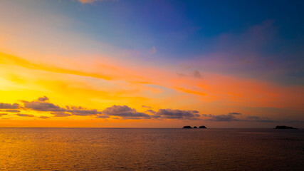 Wall Mural - Sunset Sky  on the beach with Twilight in the Evening as the colors of Sunset Horizon scene