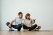 © standret - Family of mother, father and daughter are doing yoga at home