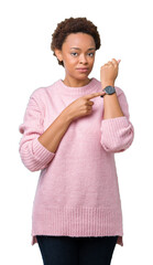 Sticker - Beautiful young african american woman over isolated background In hurry pointing to watch time, impatience, upset and angry for deadline delay