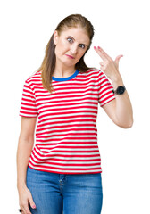 Poster - Middle age mature woman wearing casual t-shirt over isolated background Shooting and killing oneself pointing hand and fingers to head, suicide gesture.