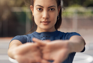 Poster - Sports helps to develop mental and physical toughness. Portrait of a sporty young woman stretching her arms on a sports court.