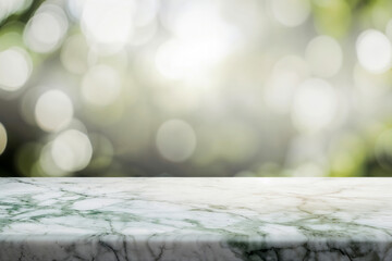 Poster - Empty marble table top against a soft green bokeh background, perfect for product display