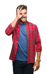 Poster - Young handsome man over isolated background doing ok gesture with hand smiling, eye looking through fingers with happy face.