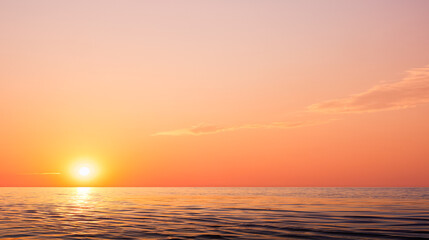 Colorful orange sunrise sky background over sea in the morning with yellow sunlight reflection on sea surface in golden hour time. Beautiful idyllic sunset seascape view