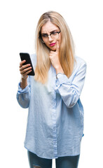 Sticker - Young beautiful blonde business woman using smartphone over isolated background serious face thinking about question, very confused idea