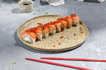 Sticker - Salmon Roll with Red Caviar on Ceramic Plate - Japanese Sushi Close-up