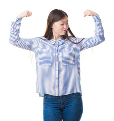 Sticker - Young Chinese woman over isolated background showing arms muscles smiling proud. Fitness concept.