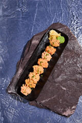 Sticker - Spicy Sushi Set on Black Slate Plate with Ginger and Wasabi, Artistic Food Presentation