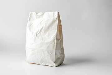 Wall Mural - Detailed photograph of single white paper bag on white background, isolated and clean