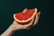 © ArtSpree - Female hand close-up crushes grapefruit on a black background. Studio isolated background.. Beautiful simple AI generated image in 4K, unique.