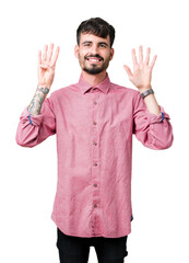 Wall Mural - Young handsome man wearing pink shirt over isolated background showing and pointing up with fingers number nine while smiling confident and happy.