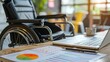 © Zahid - Wheelchair in the accessible accounting department office, laptop displaying profit forecasting analysis. Annual economic revenue trends on a notebook in the office that is accessible to employees