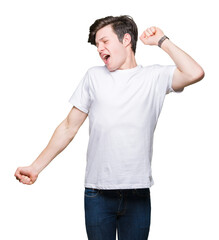 Poster - Young handsome man wearing casual white t-shirt over isolated background stretching back, tired and relaxed, sleepy and yawning for early morning