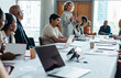 © Jacob Lund - Confident woman leading a business meeting in a modern boardroom with diverse colleagues