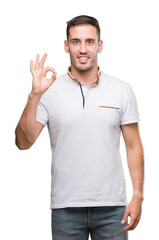 Poster - Handsome young casual man wearing white t-shirt doing ok sign with fingers, excellent symbol