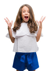 Wall Mural - Brunette hispanic girl celebrating crazy and amazed for success with arms raised and open eyes screaming excited. Winner concept