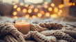 © Agata25 - Cozy Home Atmosphere with Warm Candlelight and knitted throw