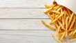© Silard - Delicious french fries in paper box on white wooden table with copy space for text