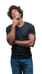 Wall Mural - afro american man over isolated background with hand on chin thinking about question, pensive expres
