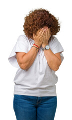 Wall Mural - Beautiful middle ager senior woman wearing white t-shirt over isolated background with sad expression covering face with hands while crying. Depression concept.