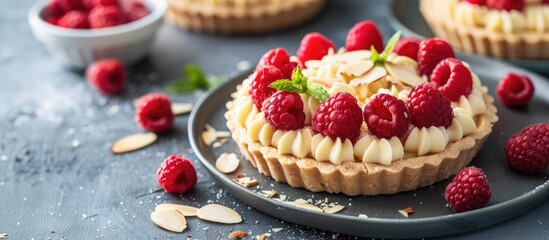 Poster - Raspberry tartlet with vanilla custard almond flakes and copy space image