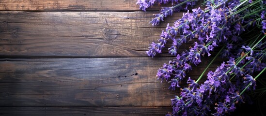 Leinwandbilder - Lavender flowers on a wooden backdrop with copy space image