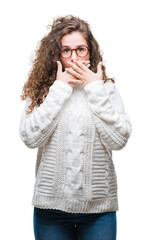 Canvas Print - Beautiful brunette curly hair young girl wearing winter sweater over isolated background shocked covering mouth with hands for mistake. Secret concept.