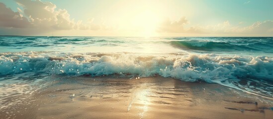Poster - Tropical beach with sunlit waves creating an abstract background perfect as a copy space image for summer vacation and travel themes with a vintage filter