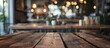 © vxnaghiyev - A focused empty brown wooden table with a blurred coffee shop or restaurant background creates a perfect copy space image for your photos or product showcases
