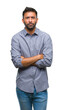 © Krakenimages.com - Adult hispanic man over isolated background skeptic and nervous, disapproving expression on face with crossed arms. Negative person.