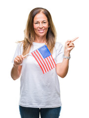 Wall Mural - Middle age hispanic woman holding flag of United States of America over isolated background very happy pointing with hand and finger to the side