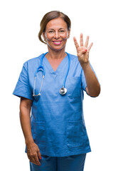 Canvas Print - Middle age senior nurse doctor woman over isolated background showing and pointing up with fingers number four while smiling confident and happy.