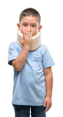 Canvas Print - Dark haired little child injured wearing neck collar cover mouth with hand shocked with shame for mistake, expression of fear, scared in silence, secret concept