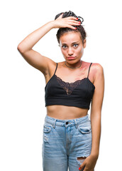 Poster - Young braided hair african american with pigmentation blemish birth mark over isolated background confuse and wonder about question. Uncertain with doubt, thinking with hand on head. Pensive concept.