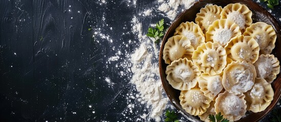 Aufkleber - Delicious uncooked ravioli with flour on a dark backdrop showing the preparation of Italian ravioli and Russian pelmeni with a blank area for text or images. with copy space image