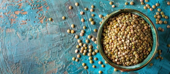 Poster - Bowl of uncooked lentils placed on table with room for text or other images in frame. with copy space image. Place for adding text or design