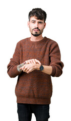 Wall Mural - Young handsome man wearing winter sweater over isolated background In hurry pointing to watch time, impatience, upset and angry for deadline delay