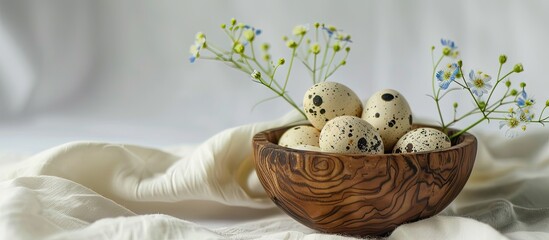 Aufkleber - Quail eggs in a wooden bowl with a flower on a white background creating a serene copy space image