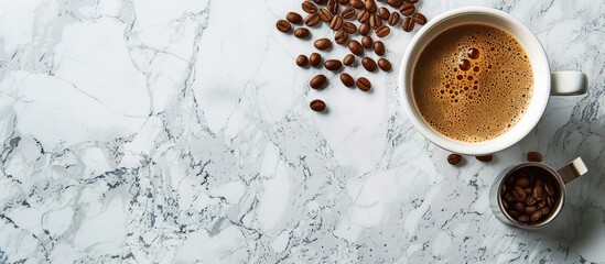 Wall Mural - Coffee cup and beans on marble surface with copy space image