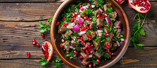 Poster - Georgian cuisine offers a healthy salad comprising beef onion and cilantro in a sweet and sour sauce sprinkled with pomegranate seeds captured elegantly against a rustic wooden backdrop in a copy spac
