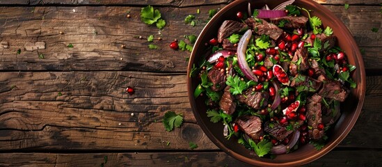 Poster - Georgian cuisine offers a healthy salad comprising beef onion and cilantro in a sweet and sour sauce sprinkled with pomegranate seeds captured elegantly against a rustic wooden backdrop in a copy spac