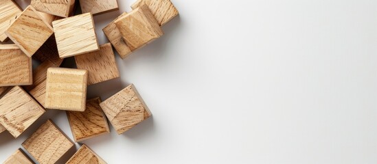 Poster - Natural wooden cubes on a white backdrop with copy space image