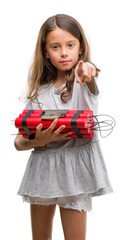 Wall Mural - Brunette hispanic girl holding a bomb pointing with finger to the camera and to you, hand sign, positive and confident gesture from the front