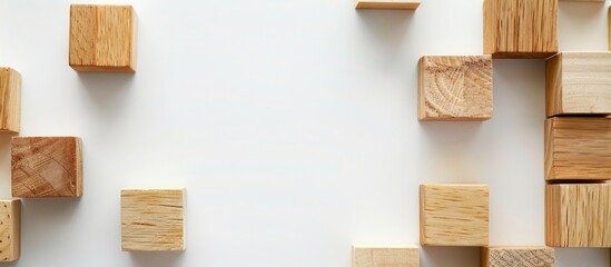 Poster - Natural wooden cubes on a white backdrop with copy space image