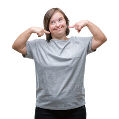 Poster - Young adult woman with down syndrome over isolated background smiling confident showing and pointing with fingers teeth and mouth. Health concept.